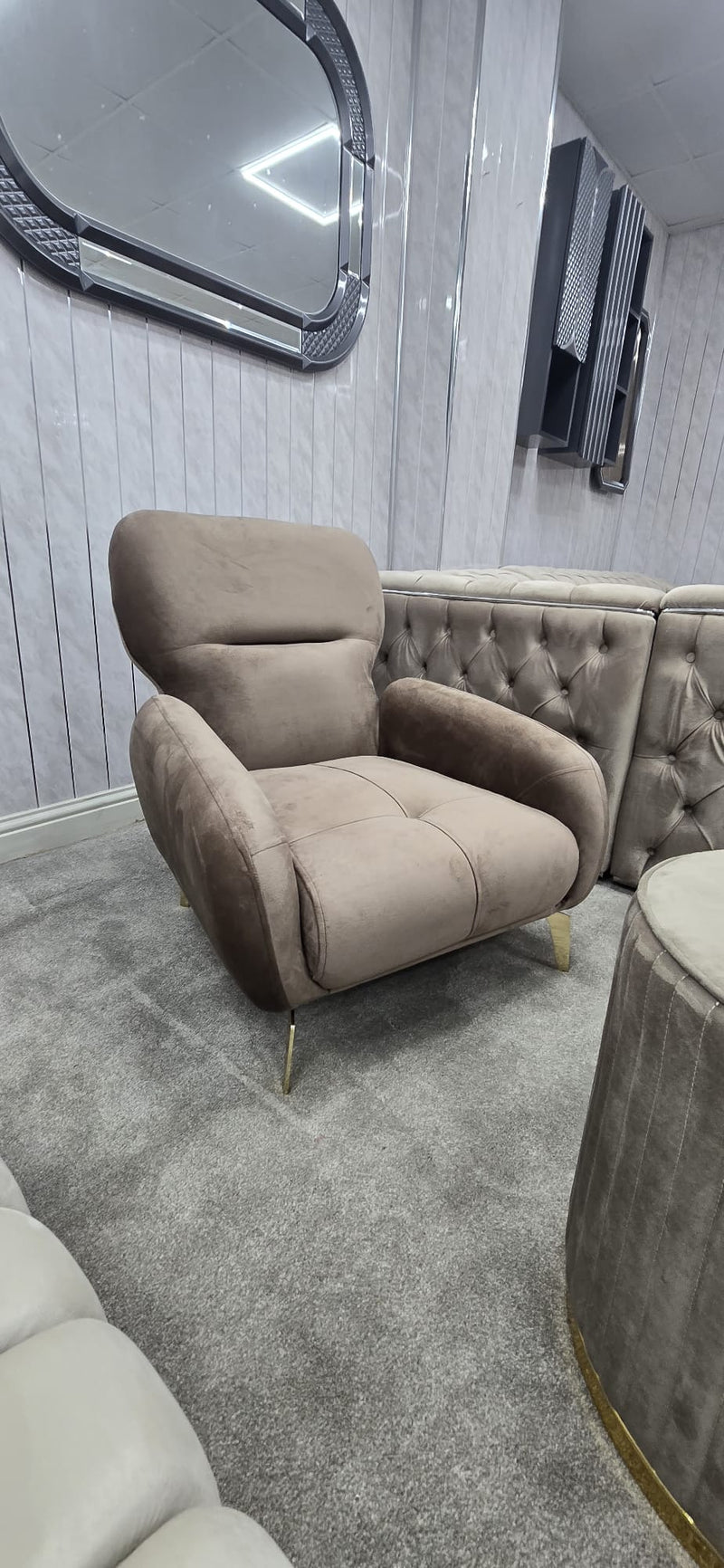 Beige armchair in a room with gray walls and carpet