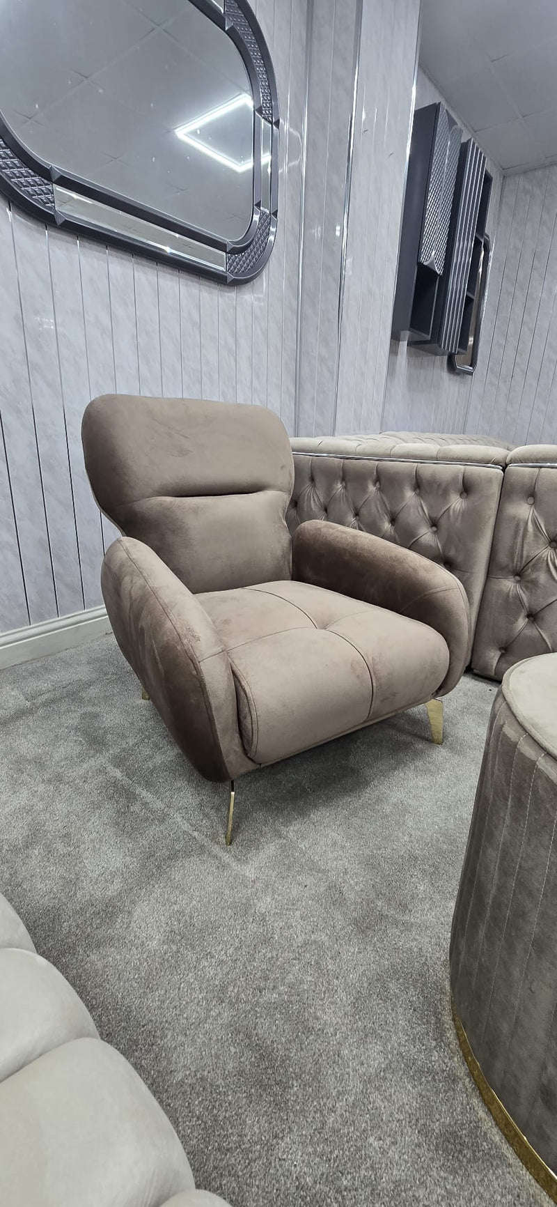 Beige armchair in a room with gray walls and carpet
